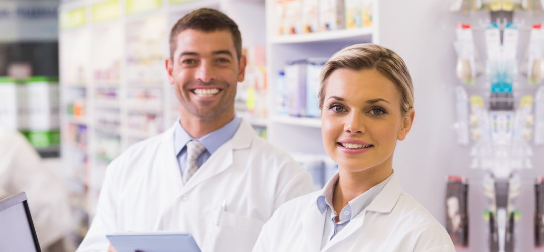 two pharmacists smiling